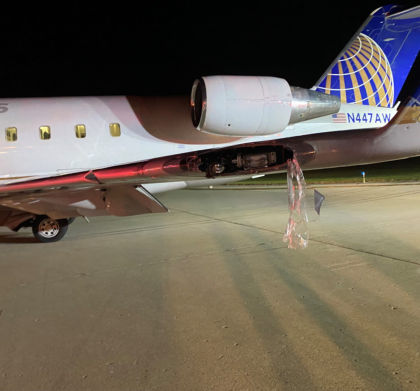 Photograph 6 – View of Minor Damage to Left Wing (Courtesy Air Wisconsin)
