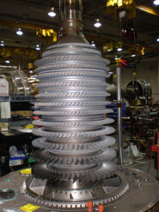 Photo 17: HPC rotor showing all of the blades were in place The tips of all of the 6th, 7th, 8th, and 9th stage compressor blades had circumferential rub marks. The 6th, 7th, 8th, and 9th stage compressor blades oriented towards the side of