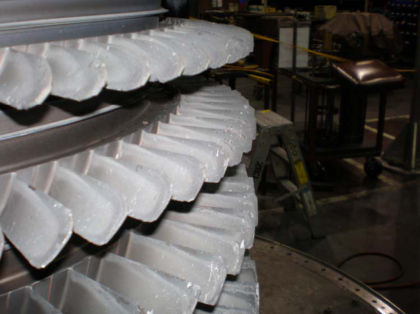 Photo 19: Burned compressor blade tips at rear of compressor All of the HPC stator vanes were in place. Many of the HPC stator vane airfoils had nicks and dents and those airfoils towards the rear of the compressor were burned.