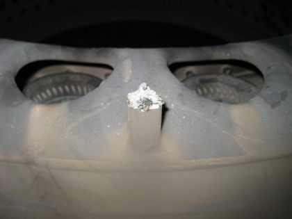 Photo 20: Broken lug on combustor dome (Delta) 10.6 Low pressure turbine The LPT case was intact except for a 4-inch long axial crack from the front flange at 6 o’clock that progressed clockwise about 20 inches. (Photo 21) The flap of the f