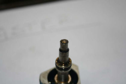 Photo 29: Metallic material on master MCD (P&W) With the radial drive shaft still installed, it was not possible to rotate the main gearbox with a wrench and adapter. With the radial drive shaft and the starter removed, the main gear box co