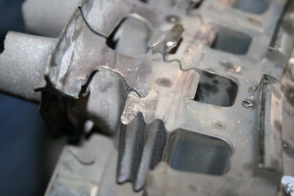 Photo 2: Close up of lug No. 1 with arrow pointing to the dark-colored,