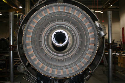 Photo 12: 1st stage turbine vanes all in place (P&W) The 2nd stage turbine vanes were all in place in the HPT case. (Photo 13) There were several randomly located 2nd stage turbine vanes that had the rear flow guides missing. All of the oth