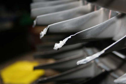Photo 18: 8th stage compressor blades showing displaced material on the tips (P&W)