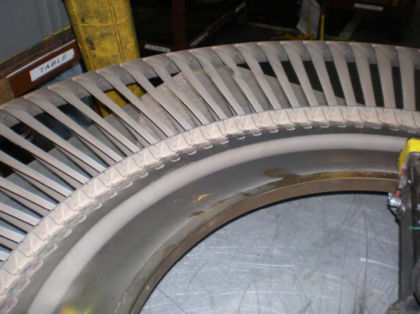 Photo 25: 5th stage turbine blades There were three 3rd stage turbine vane clusters, two that were adjacent, that had 1/4- to 1/2-inch deep gouges on the vanes’ leading edges adjacent to the outer platform. Most of the LPT vanes had nicks a