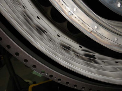 Photo No. 14: View of the combustor outer liner showing random sooting. — page 31 of 41