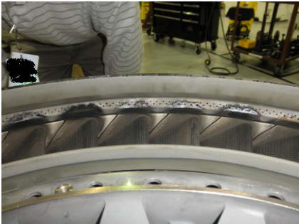 Photo No. 16: View of the 1st stage turbine vanes showing they were all in place — page 33 of 41 (2 of 2)