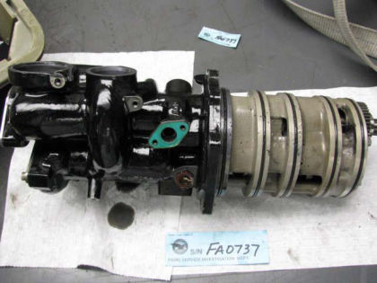 Figure 11. Oil pump, with 2/2.5 bearing scavenge oil entry port noted (left)