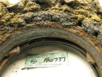 Figure 25. No. 5 bearing support housing The No. 5 bearing was dry and oxidized. The cage and races were severely discolored, but intact. The raceways were smeared with metal. No races were fractured. The bearing rollers were disintegrated;