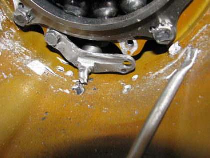 Figure 30. Damaged and detached oil scavenge pump ferrule-tube bracket Underneath the No. 1 bearing outer race, the FIC surface was deeply fretted and gouged. See