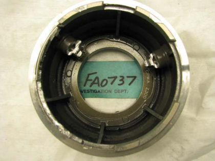 Figure 34. No. 1 bearing oil nozzle housing, showing circumferential scoring (left)