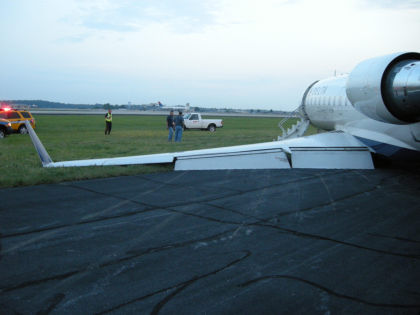 Photo 3: View from behind Left Wing (NTSB Digital Photo)