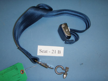 1. Photograph of the restraint and seat attachment ring from seat 21B.