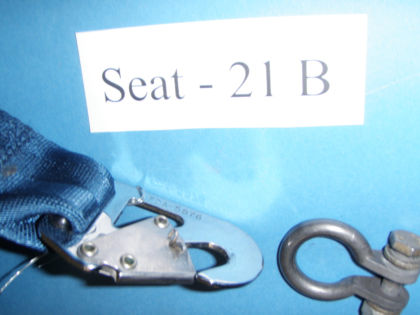 3. Side view of restraint from seat 21B showing the cotter pin and rivets through the restraints keeper and hook.