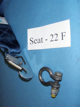 5. Angular view of the restraint from seat 22F Note: The rivets and cotter pin securing the keeper to the restraint hook