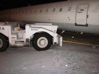 Photo 2: Airplane and Tow Tractor