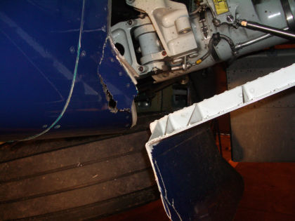 Photo 4. Left Landing Gear Door Being Raised
