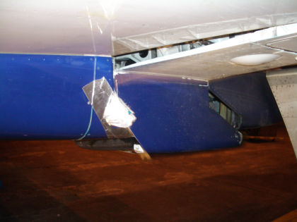 Photo 11. Landing Gear Door Breaking Through the Speed Tape
