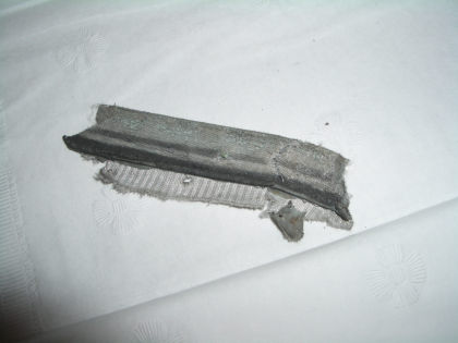 Photo 12. Piece of Torn Fairing Seal