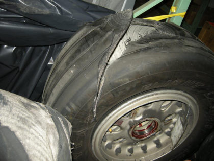 Photo 5 - Showing Damage to Left Outboard Tire