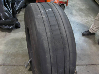 Photo 6 - Showing Damage to Left Inboard Tire