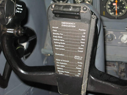 Photo 7 - Cockpit Control Yoke Showing Checklist for Emergency Evacuation