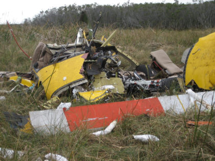 Photo 8. Ground view of front of helicopter.
