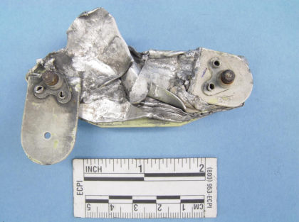 Figure 2: Photograph of lower stop. The L-bracket indicated by the white box fractured at the