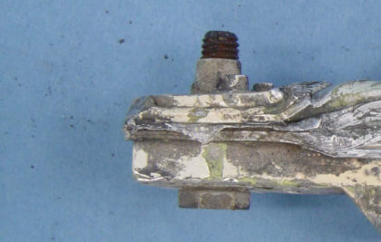 Figure 3: a) Side view of the lower stop. The bracket inside the white box is the same as the (right)