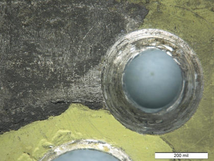 Figure 18: Macrophotograph from the lower stop bracket from N260AE. Cracks were observed
