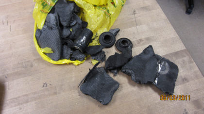 Photo - FAA supplied image of brake parts recovered from the runway
